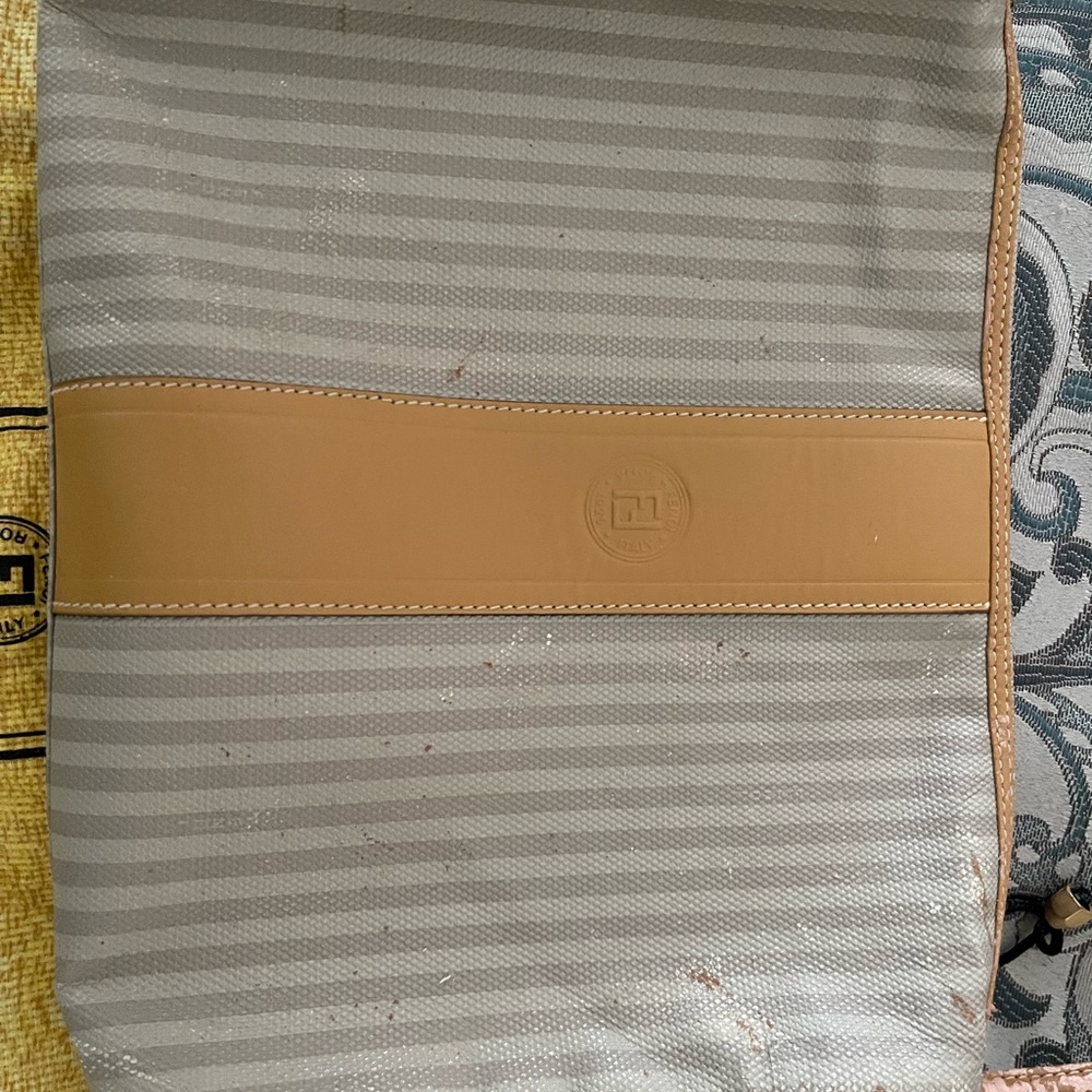 Vintage and damaged FENDI classic striped bag needs refurbishing